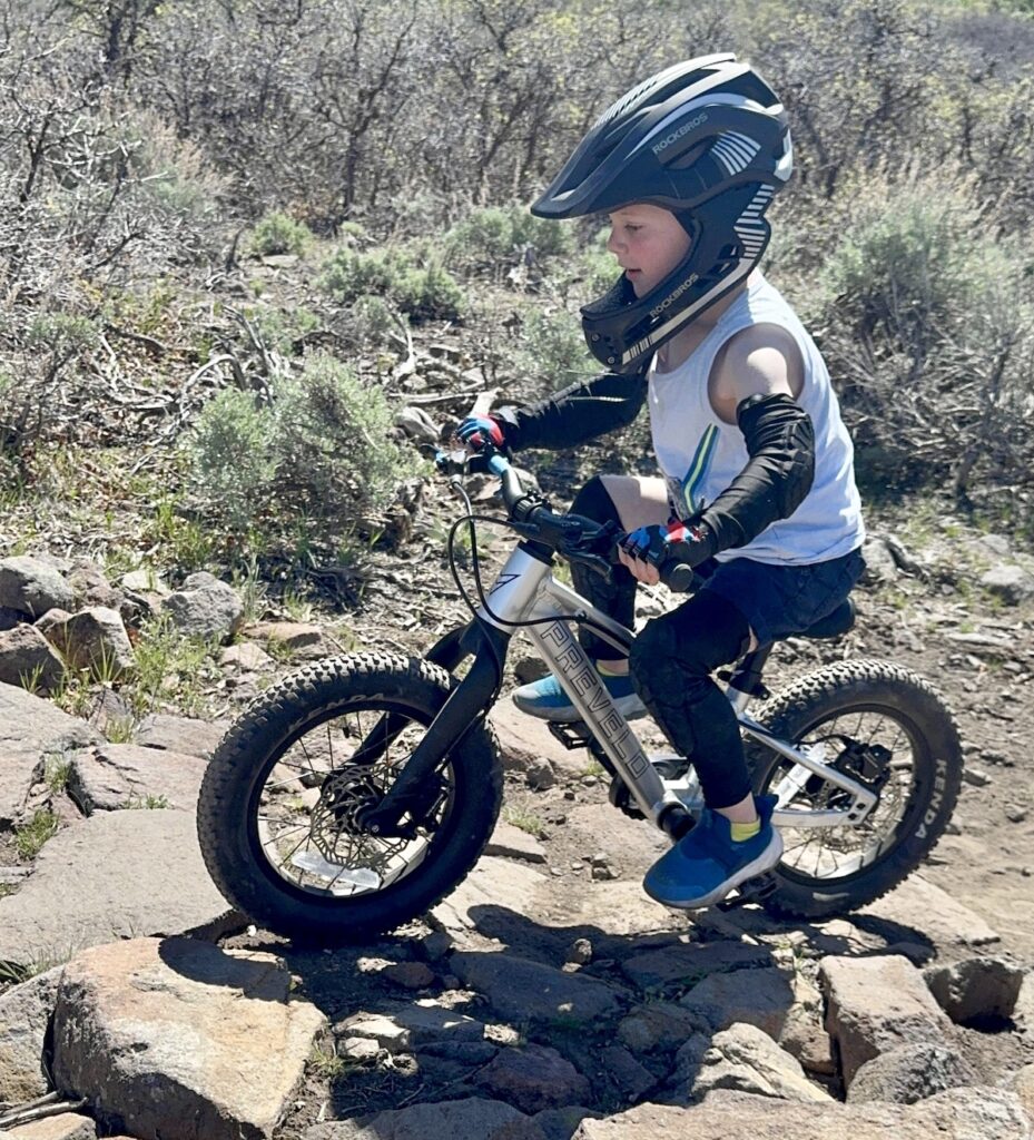 prevelo Zulu One with pedals going over a rock garden