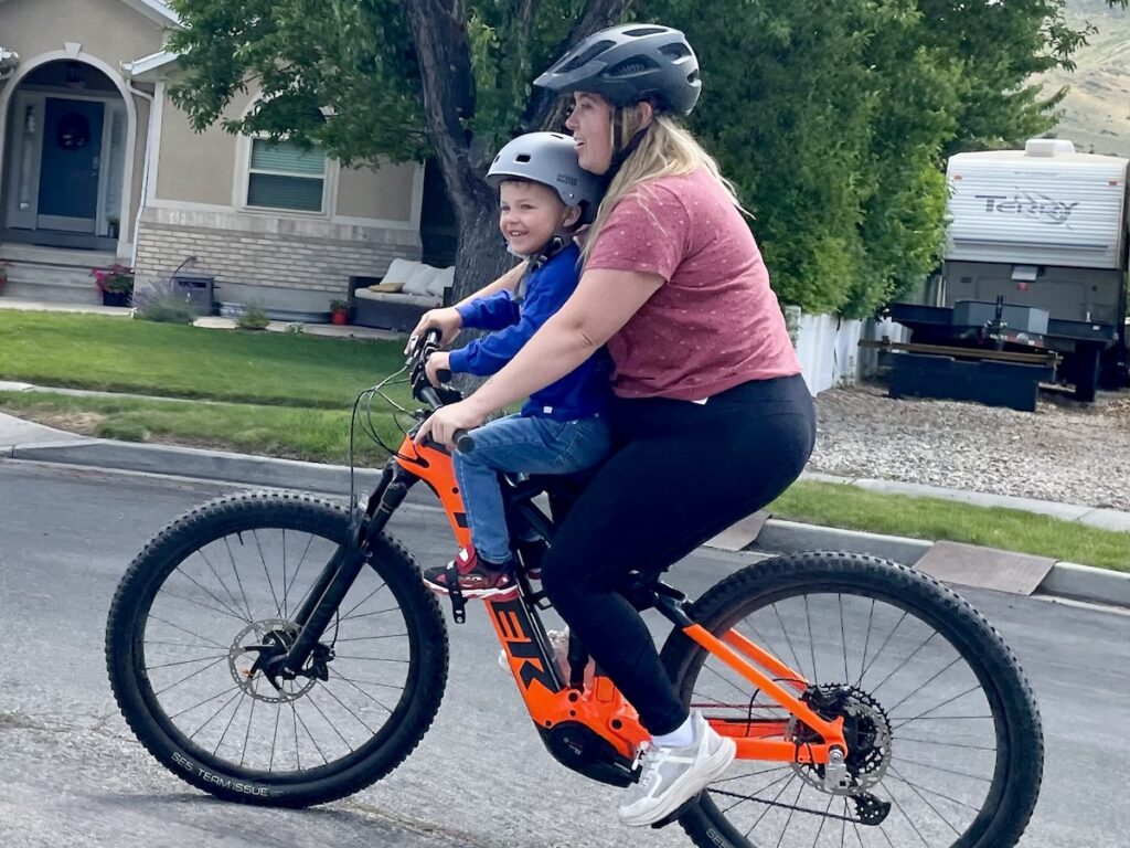 mom and son on shotgun pro bike seat