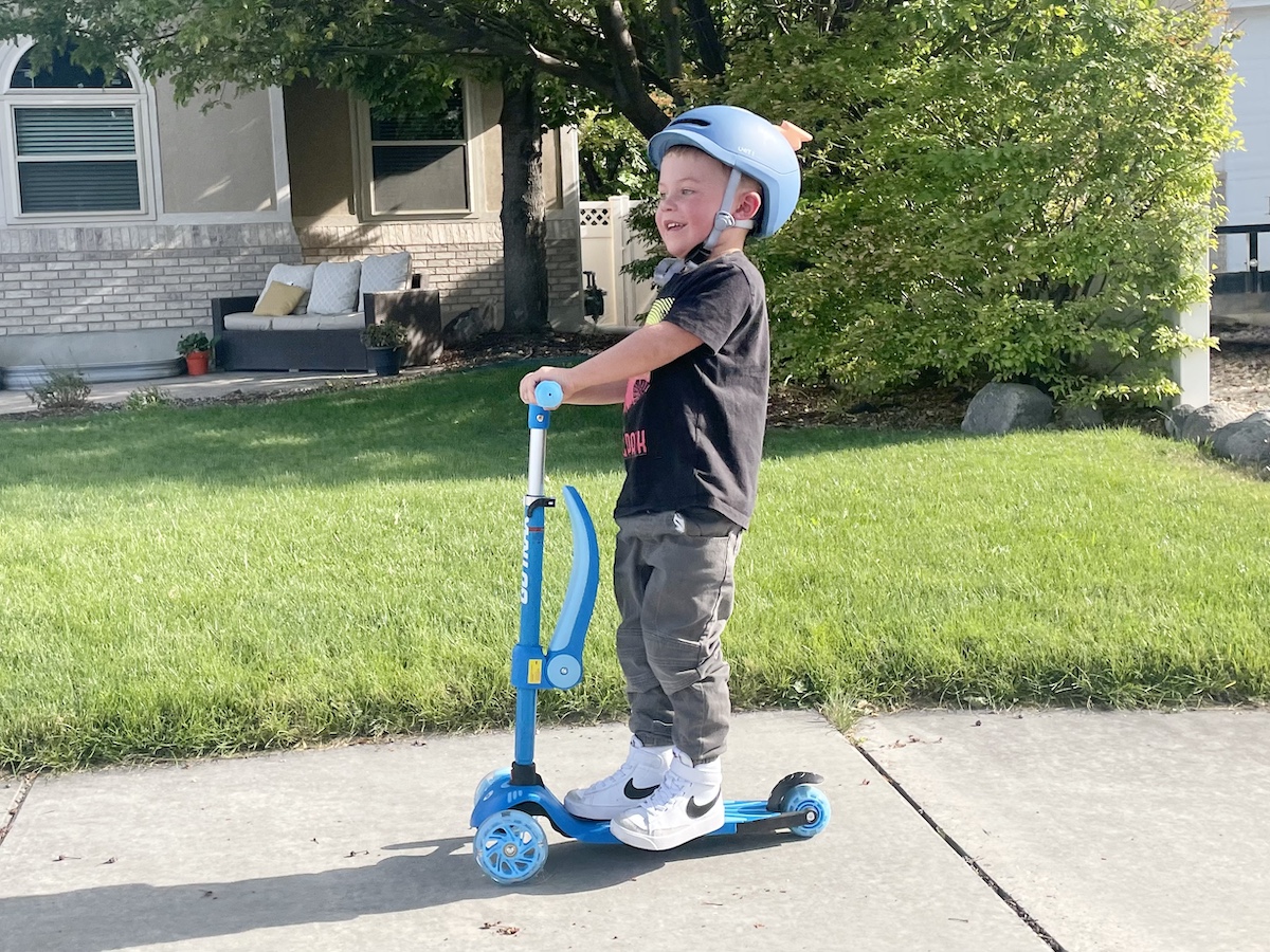 toddler riding the gotrax scooter
