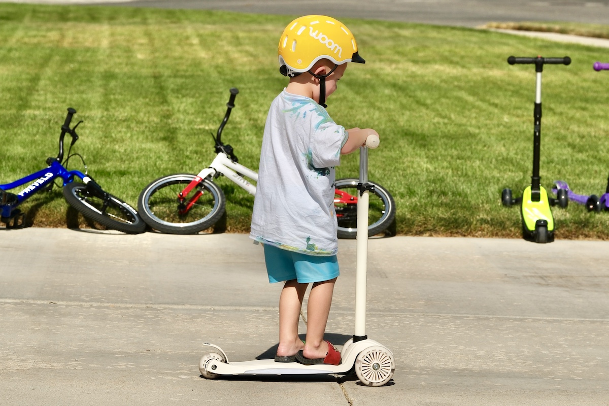 toddler riding the hover 1 scout scooter