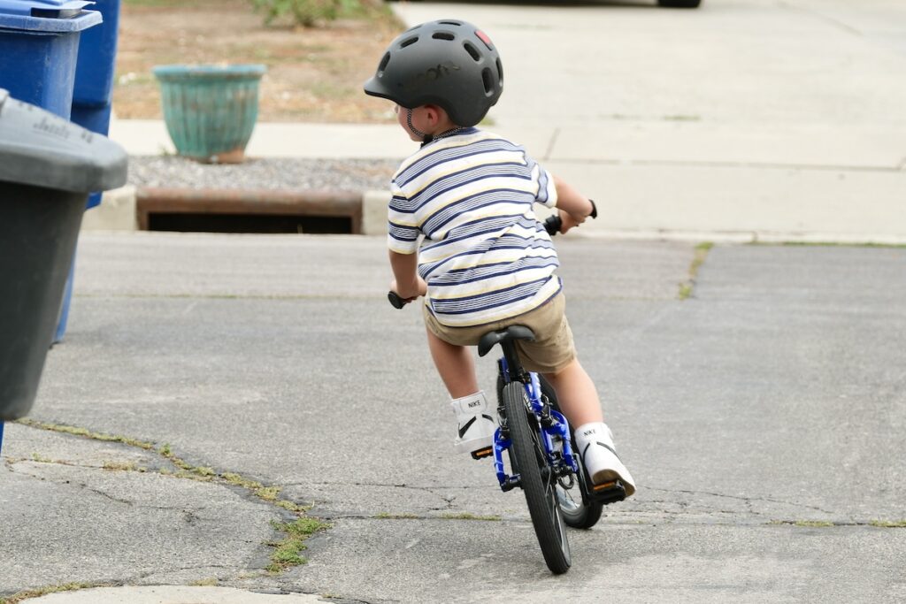 young rider leaning into a turn on the Prevelo Alpha Two