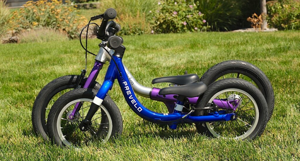 littlebig small balance bike next to Prevelo Alpha Zero