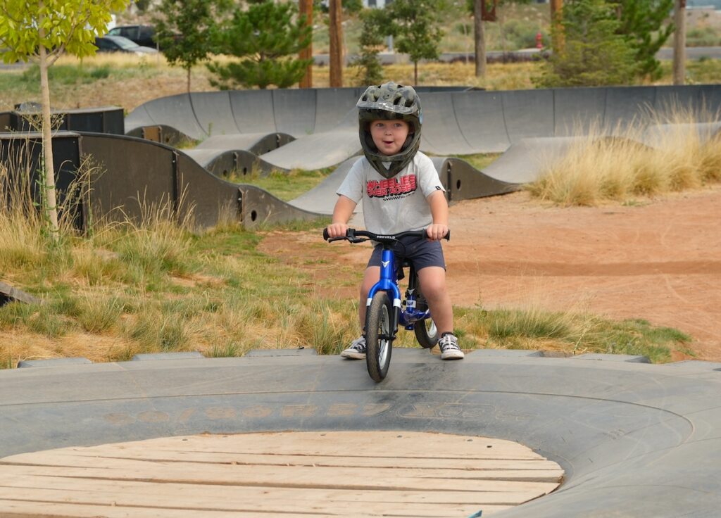 prevelo balance bike with smiling preschooler