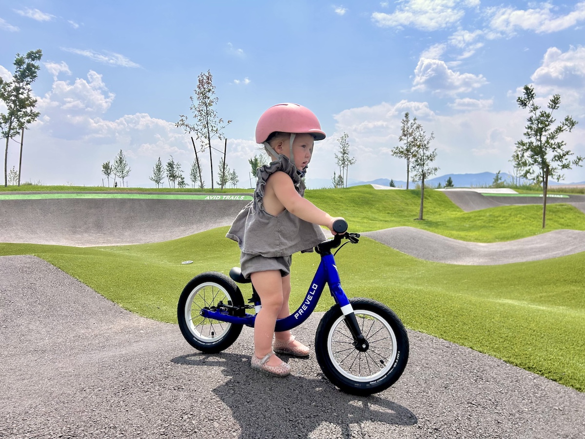 toddler on the prevelo alpha zero balance bike at a bike park
