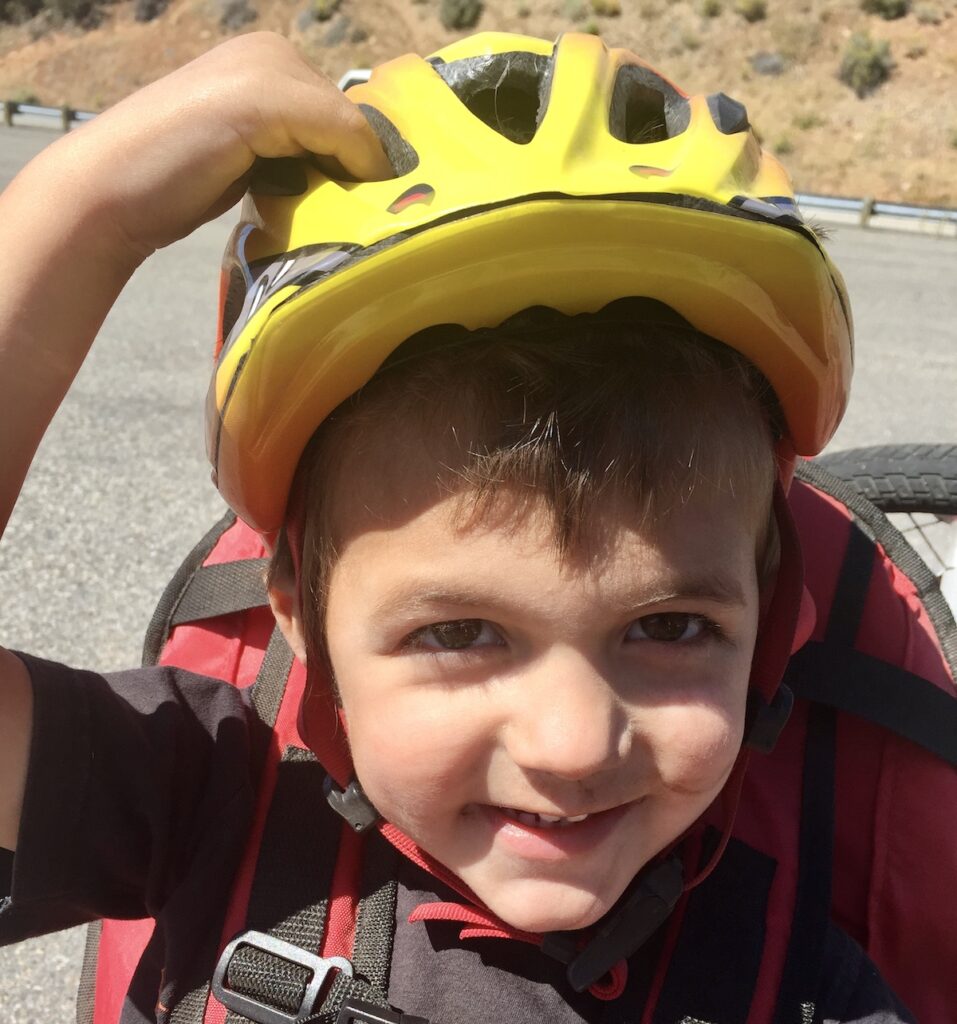 child with a helmet on too loose