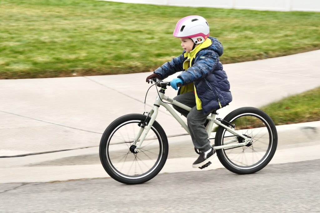 child riding the Early Rider Belter 20