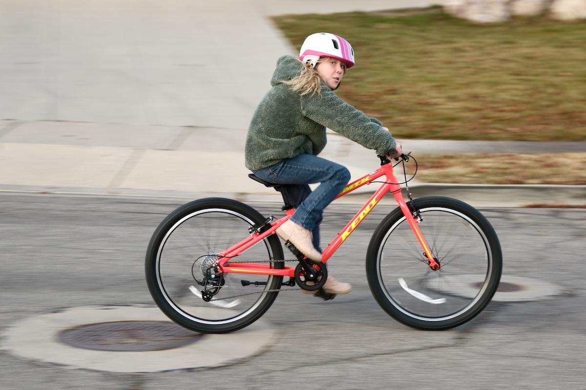 girl riding the Kent 24 inch MTX kids bike