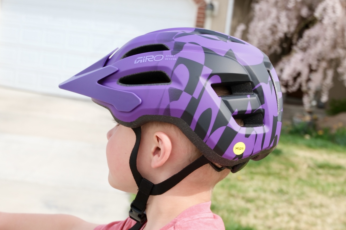 child wearing the giro fixture MIPS II youth helmet